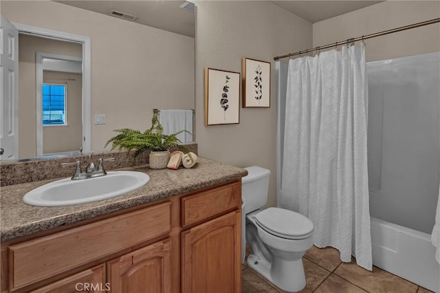 full bathroom featuring shower / tub combo with curtain, tile patterned floors, toilet, and vanity