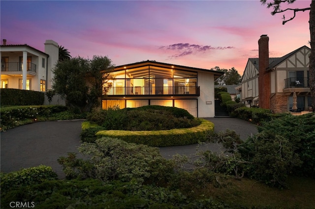 view of front of property with a balcony