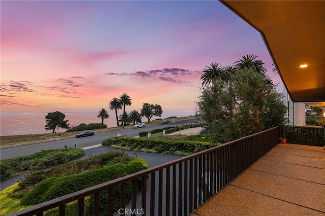 balcony at dusk with a water view