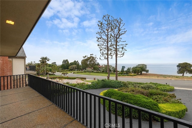 balcony featuring a water view