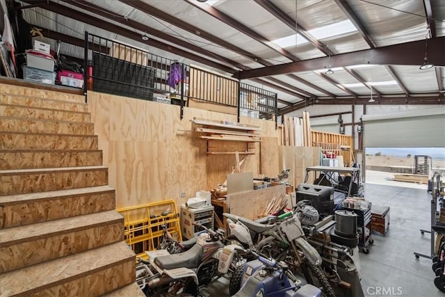 garage featuring wood walls