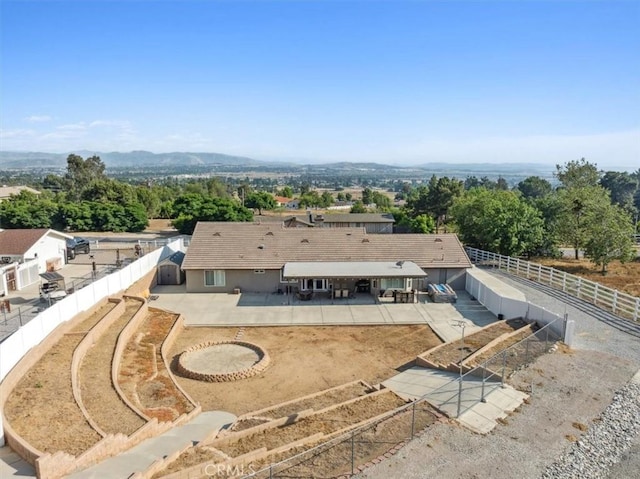 drone / aerial view featuring a mountain view