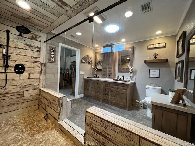 bathroom with vanity, an enclosed shower, and toilet