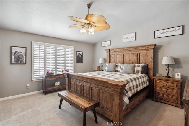 carpeted bedroom with vaulted ceiling and ceiling fan