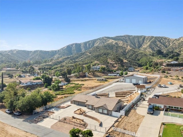 birds eye view of property featuring a mountain view