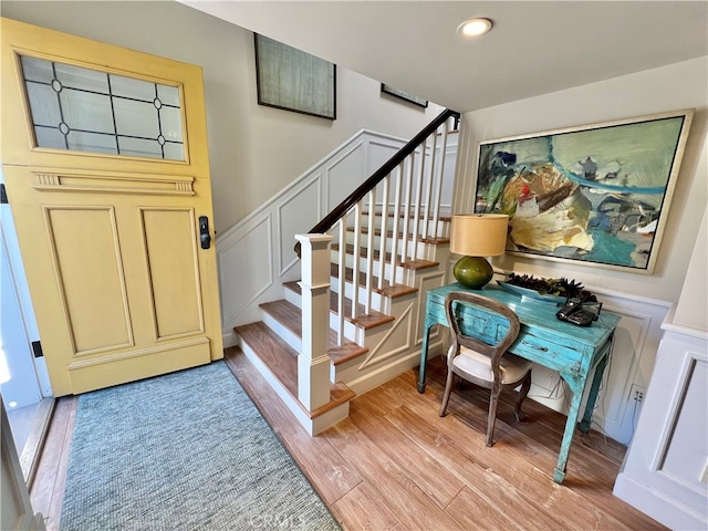 stairs with light hardwood / wood-style flooring