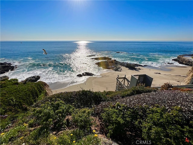 view of water feature with a beach view