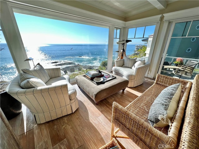 sunroom with a water view