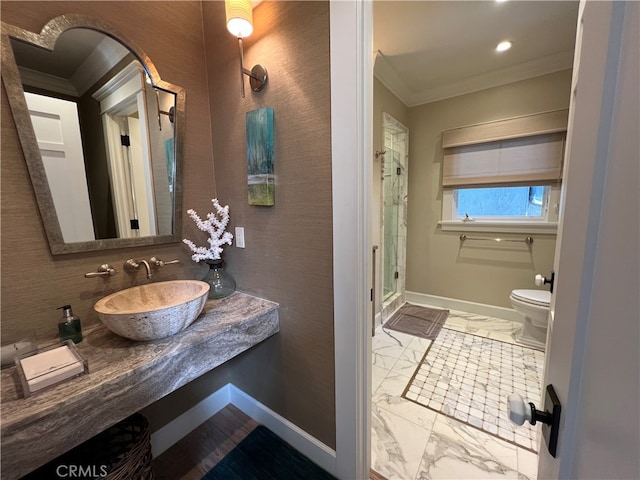 bathroom featuring walk in shower, toilet, vanity, tile patterned floors, and ornamental molding