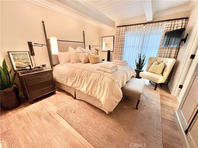 bedroom with beamed ceiling, light hardwood / wood-style floors, and ornamental molding