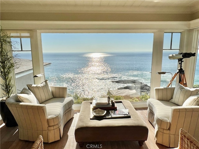 interior space featuring a water view and hardwood / wood-style floors