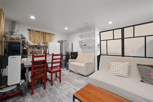 living room featuring recessed lighting and light wood-style floors