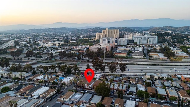 drone / aerial view with a city view and a mountain view