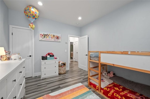 bedroom featuring recessed lighting, light wood-type flooring, and baseboards