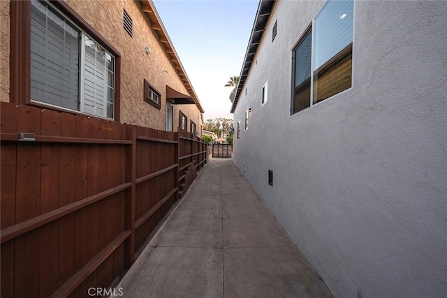 view of home's exterior featuring fence and stucco siding