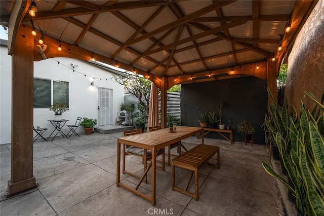 view of patio / terrace with outdoor dining area and a gazebo