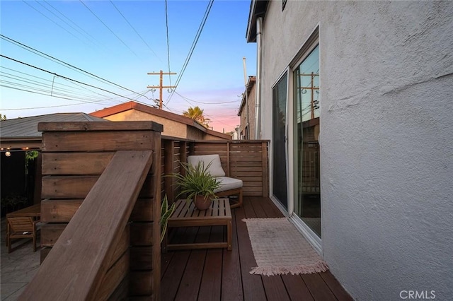 view of balcony at dusk
