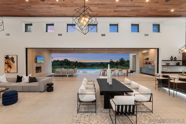 view of patio / terrace with an outdoor living space with a fireplace