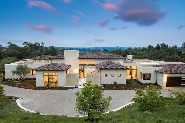 mediterranean / spanish-style home featuring a garage