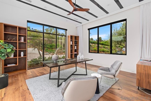 office space with hardwood / wood-style floors and ceiling fan