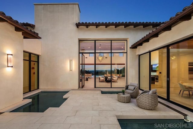 view of patio terrace at dusk