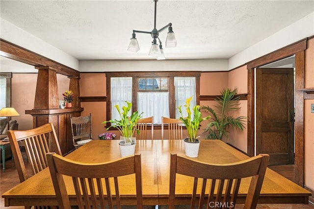 dining room featuring a textured ceiling