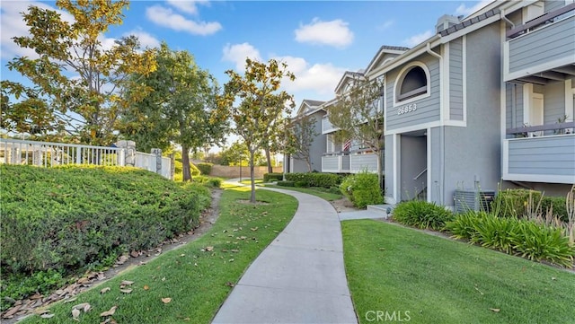 26853 Claudette St Unit 141, Canyon Country, CA 91351 - surrounding community featuring a lawn