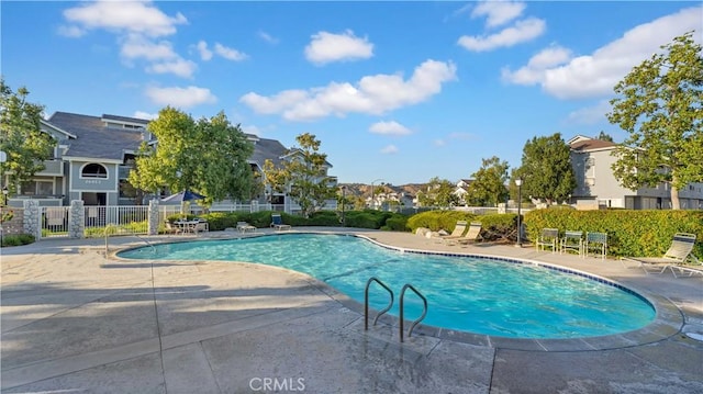26853 Claudette St Unit 141, Canyon Country, CA 91351 - community pool featuring a residential view and a patio