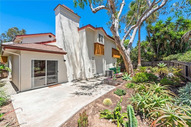 1585 Catalina, Laguna Beach, CA 92651 - back of property with stucco siding, a chimney, and a patio