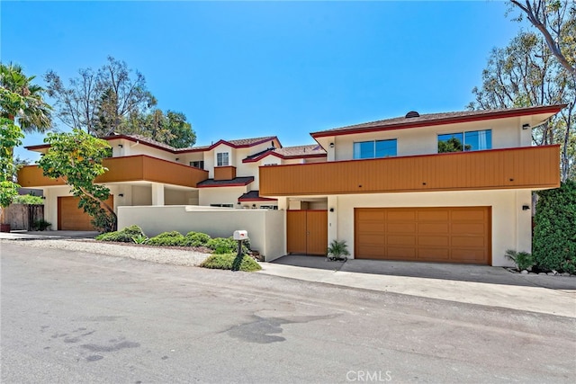1585 Catalina, Laguna Beach, CA 92651 - view of front of home with stucco siding, an attached garage, and driveway