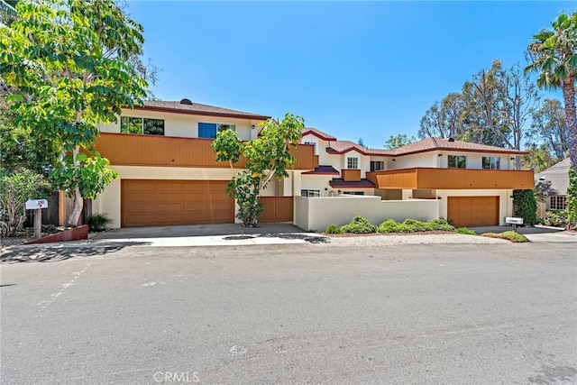 1585 Catalina, Laguna Beach, CA 92651 - view of front facade with stucco siding, an attached garage, and driveway