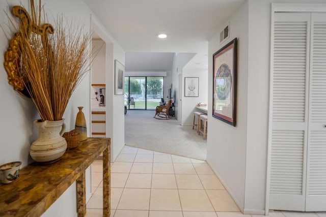 hallway with light carpet