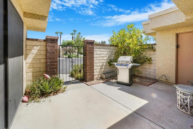 view of patio featuring a grill