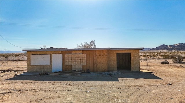 view of outbuilding featuring a mountain view