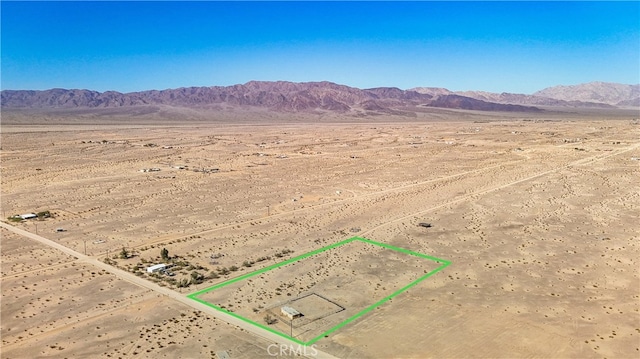 aerial view with a mountain view and a rural view