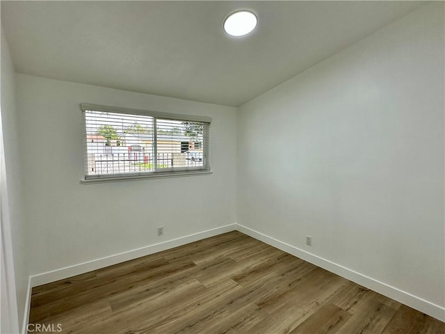 empty room featuring wood-type flooring