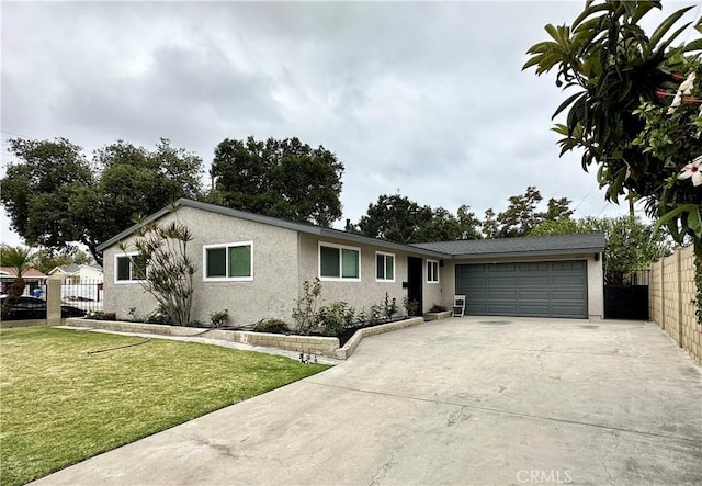 single story home with a front yard and a garage