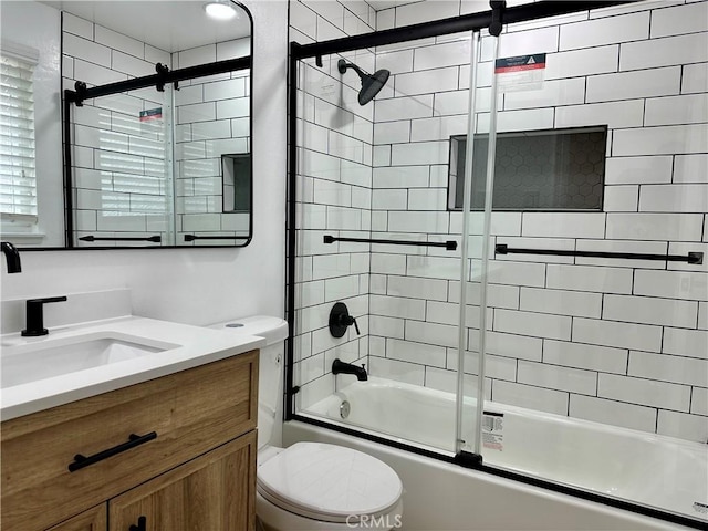 full bathroom with vanity, toilet, and enclosed tub / shower combo