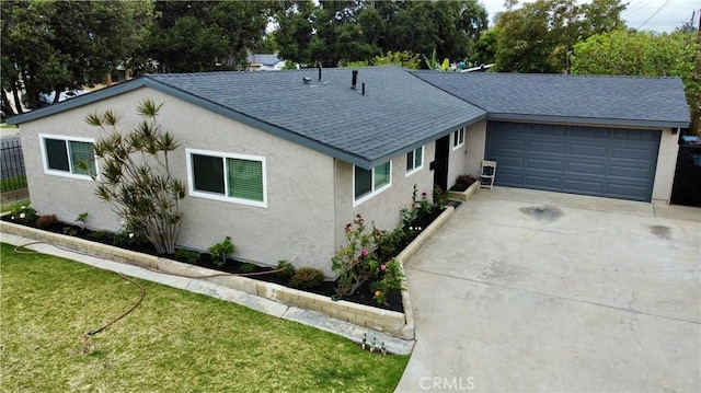 ranch-style home featuring a front yard and a garage