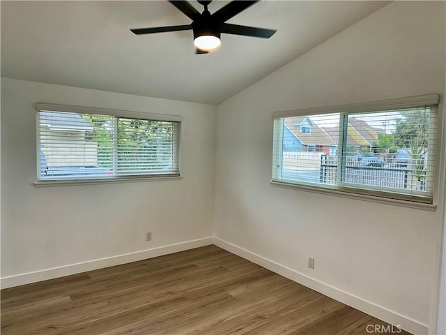 unfurnished room featuring ceiling fan, wood-type flooring, and vaulted ceiling