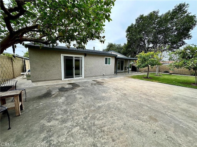 rear view of property with a patio area