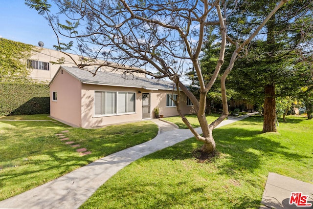 view of front of home with a front yard