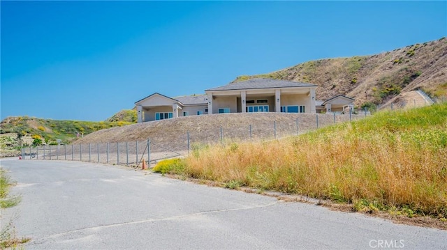 view of front of home with a mountain view