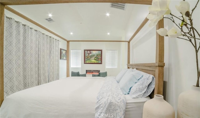 bedroom with ornamental molding