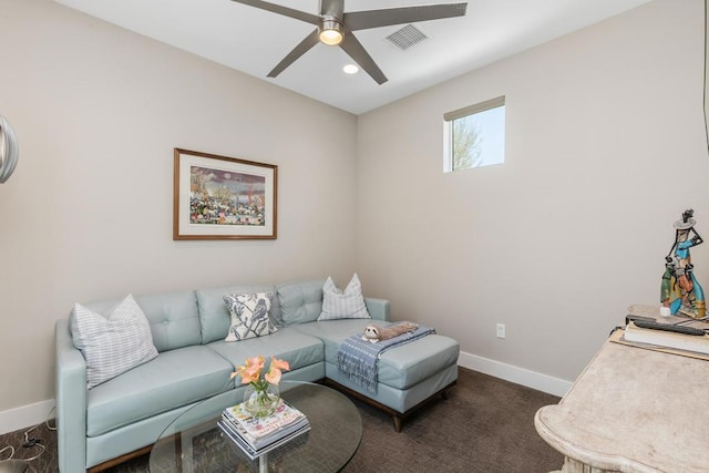 carpeted living room featuring ceiling fan