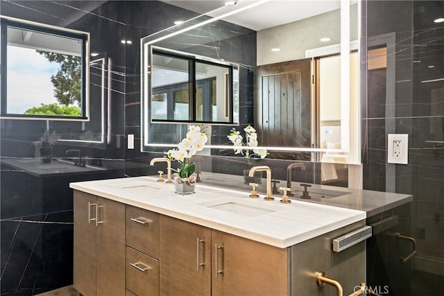 bathroom featuring tile walls, backsplash, and double vanity