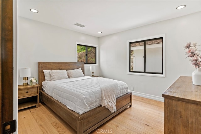 bedroom with light hardwood / wood-style floors