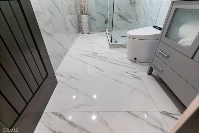 bathroom featuring tile walls, vanity, an enclosed shower, and tile patterned flooring