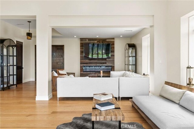 living room with light hardwood / wood-style flooring