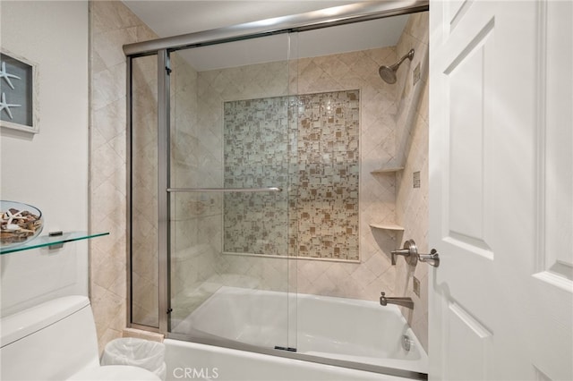 bathroom featuring toilet and enclosed tub / shower combo